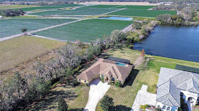 drone / aerial view with a rural view and a water view