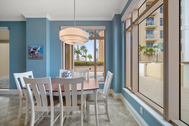 dining area featuring crown molding