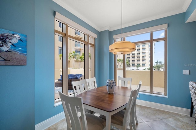 dining room featuring tile patterned flooring and crown molding