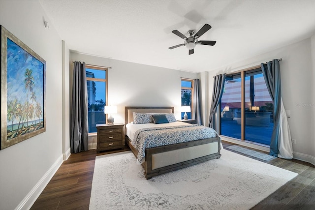 bedroom featuring dark wood-type flooring, ceiling fan, and access to outside