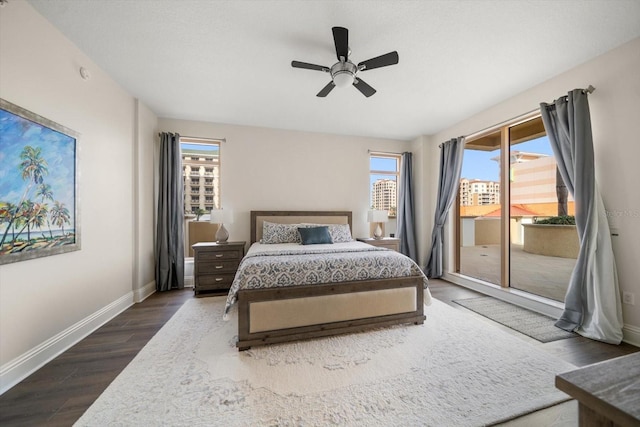 bedroom featuring access to outside, ceiling fan, and dark wood-type flooring