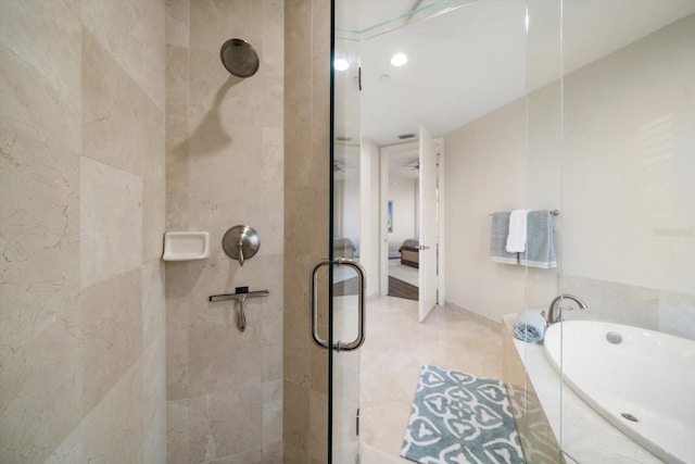 bathroom with shower with separate bathtub