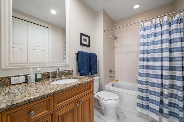 full bathroom featuring toilet, vanity, tile patterned flooring, and shower / bath combo with shower curtain