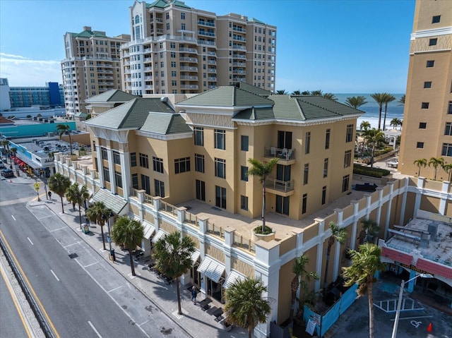 birds eye view of property with a water view