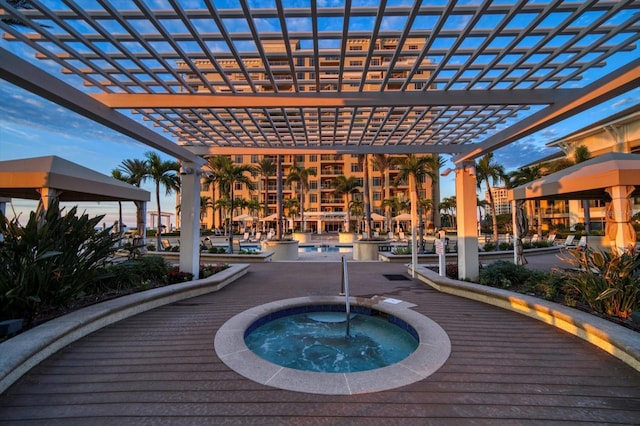 view of pool featuring a pergola and a community hot tub