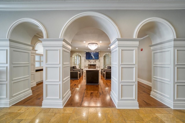 kitchen with crown molding and ornate columns