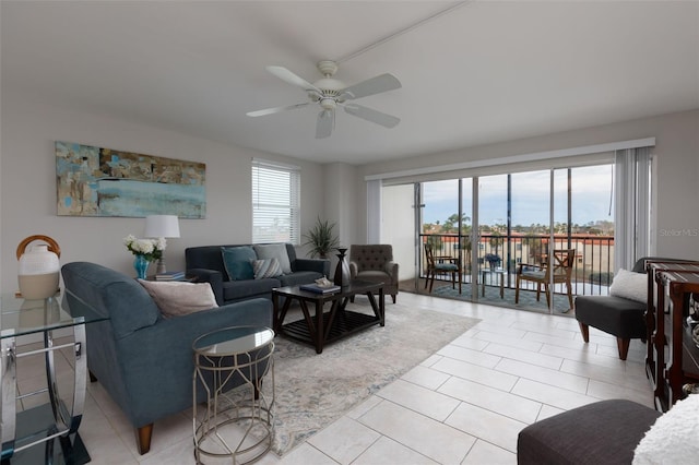 living room featuring ceiling fan and light tile patterned floors