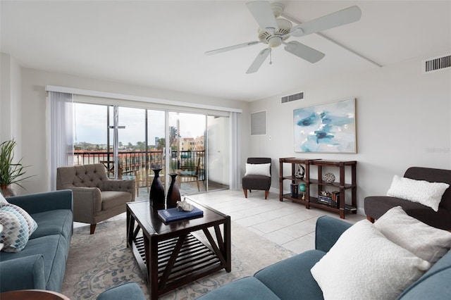 tiled living room with ceiling fan