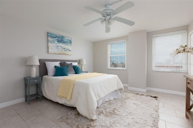 bedroom featuring ceiling fan and light tile patterned floors