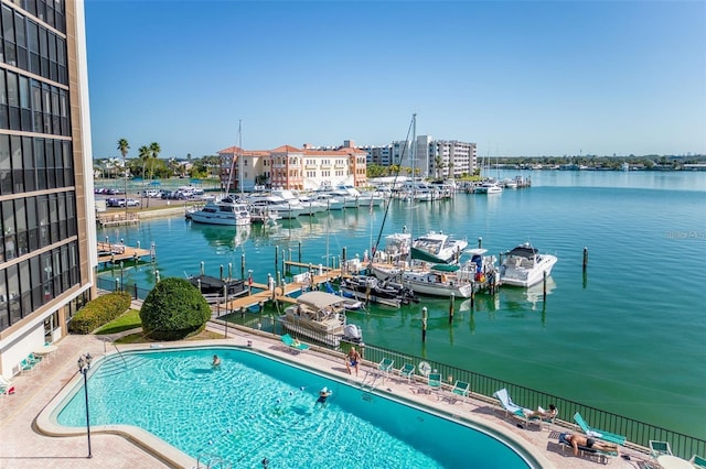 exterior space featuring a dock and a water view