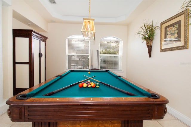 game room featuring a raised ceiling, light tile patterned floors, and pool table