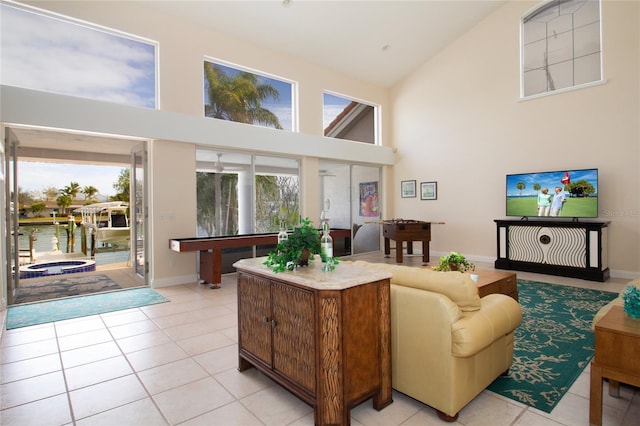 tiled living room featuring high vaulted ceiling