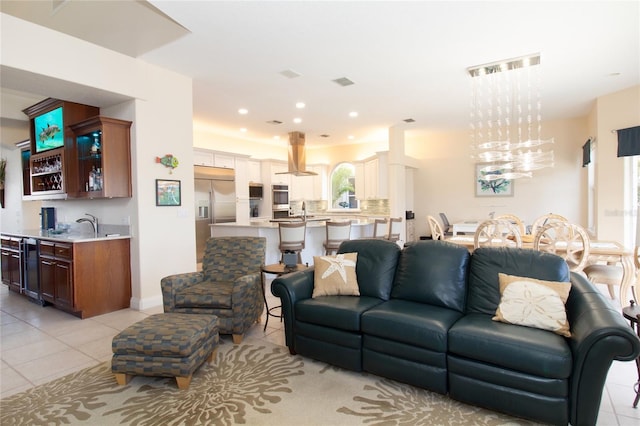 tiled living room with beverage cooler and bar