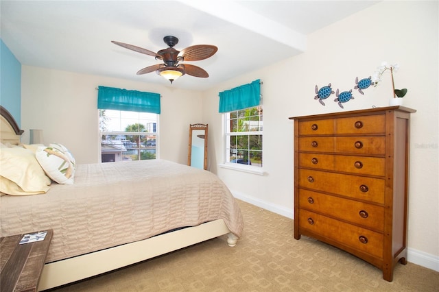 bedroom featuring ceiling fan and light colored carpet