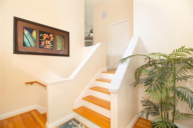 stairway with wood-type flooring