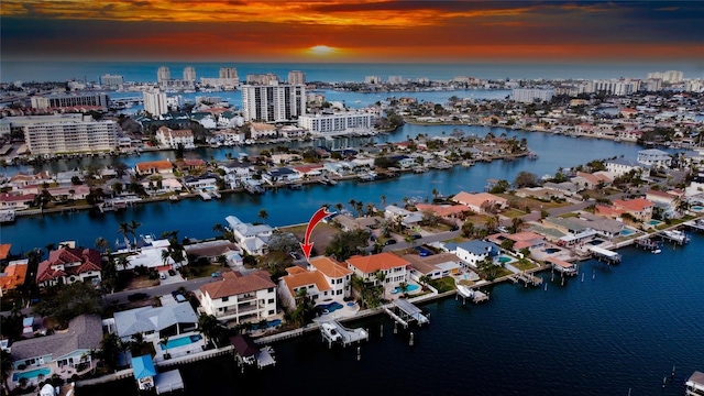 aerial view at dusk with a water view