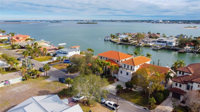 aerial perspective of suburban area with a nearby body of water