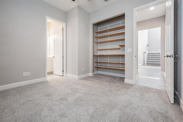 unfurnished bedroom with light carpet