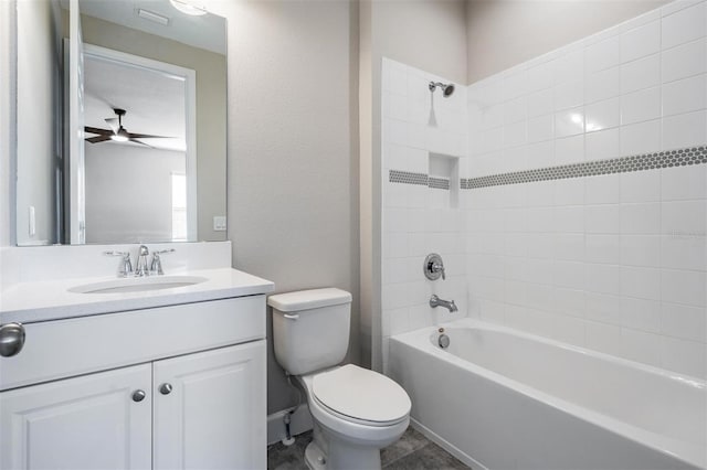 full bathroom featuring vanity, toilet, ceiling fan, and shower / washtub combination