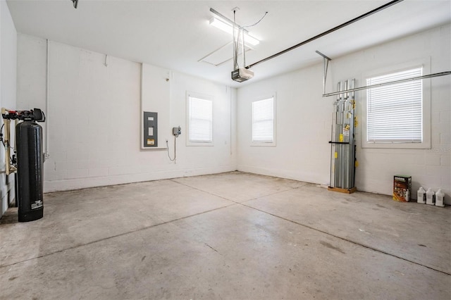 garage featuring electric panel and a garage door opener