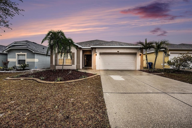 ranch-style home featuring a garage