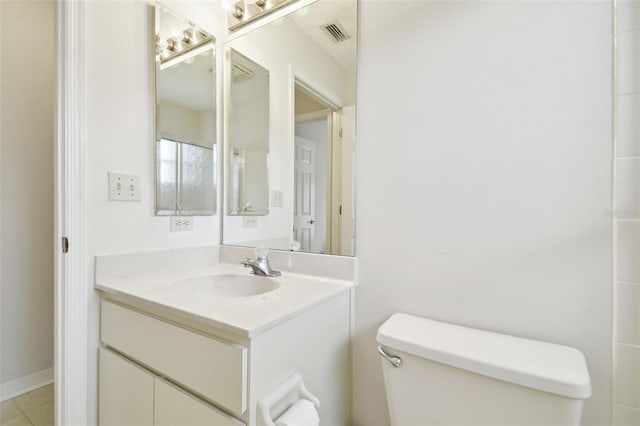 bathroom with toilet and vanity