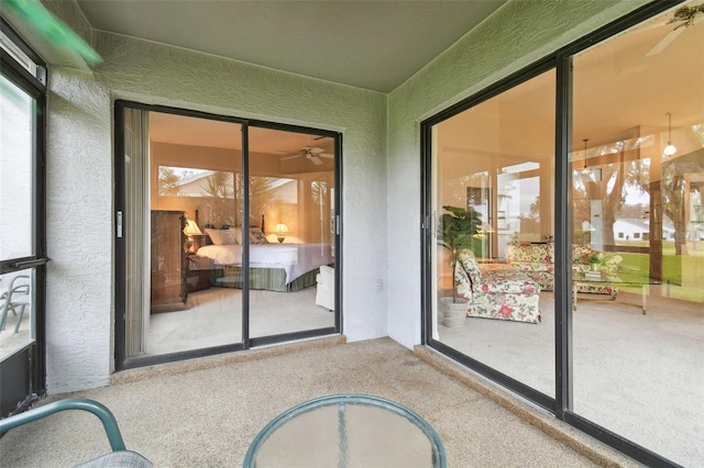 sunroom / solarium with ceiling fan