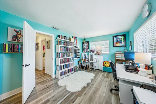 office space with light wood-type flooring