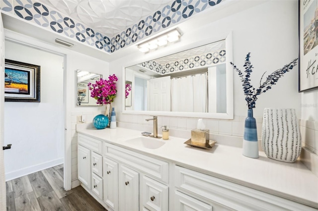 bathroom featuring wood-type flooring and vanity