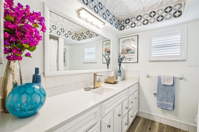 bathroom featuring hardwood / wood-style floors and vanity