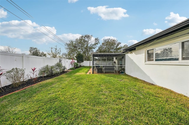 view of yard featuring a sunroom