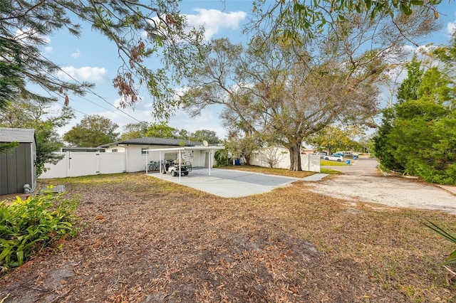 view of yard featuring a patio area and a carport