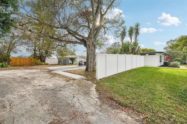 view of yard with a carport