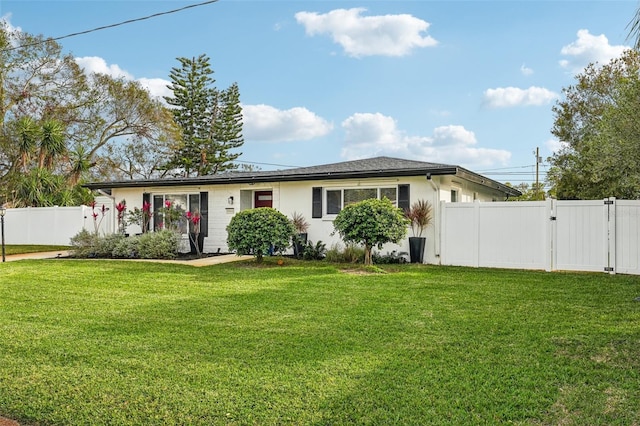 ranch-style house with a front lawn