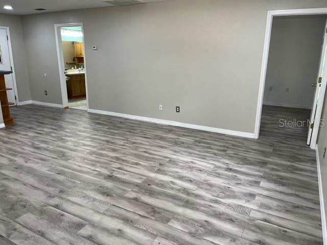 unfurnished living room with hardwood / wood-style flooring