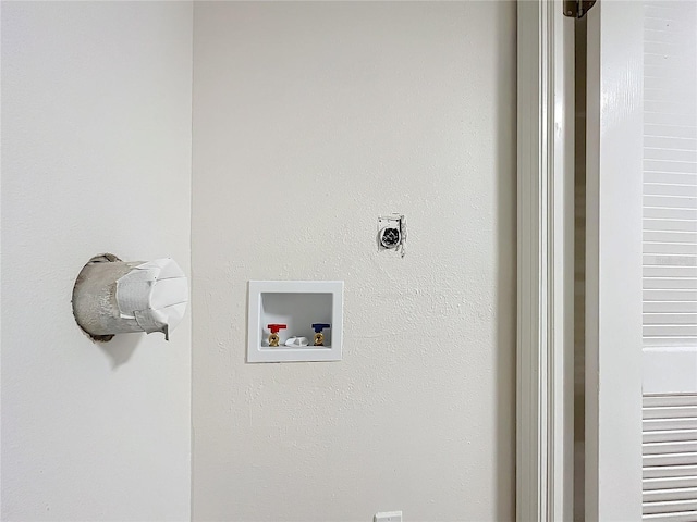 clothes washing area featuring laundry area, hookup for a washing machine, and electric dryer hookup