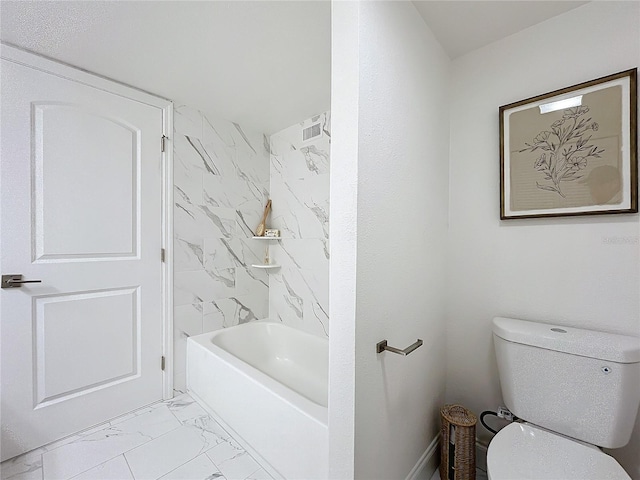 full bathroom featuring toilet and marble finish floor