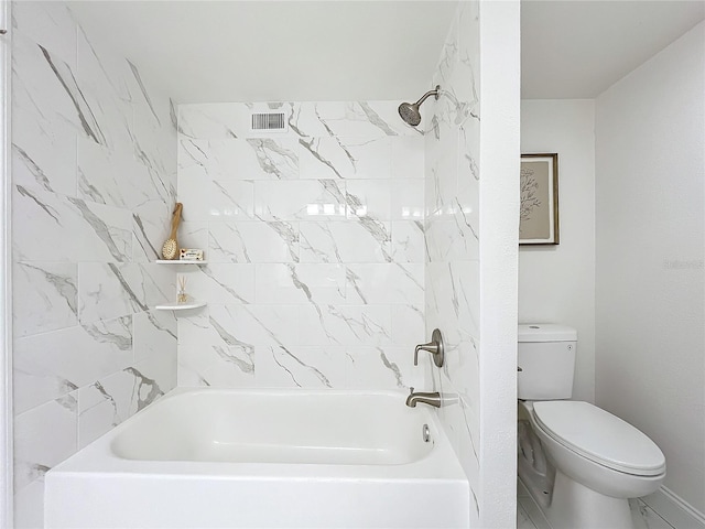 bathroom with shower / washtub combination and toilet