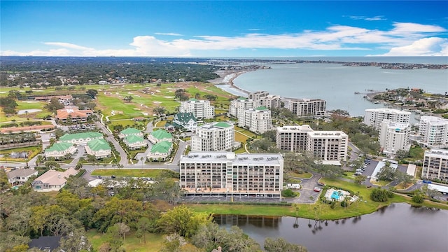 birds eye view of property with a view of city and a water view