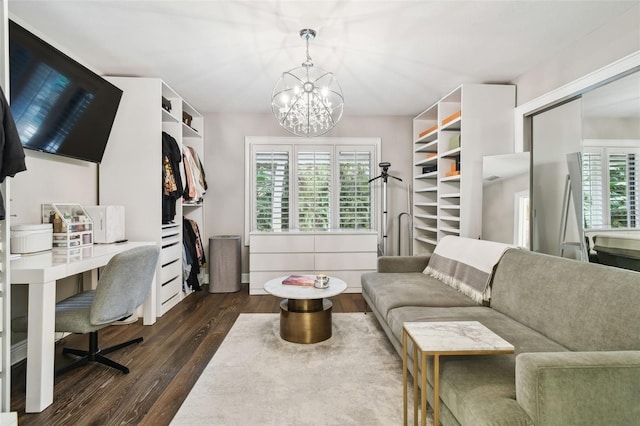 interior space with a healthy amount of sunlight, an inviting chandelier, and dark hardwood / wood-style flooring