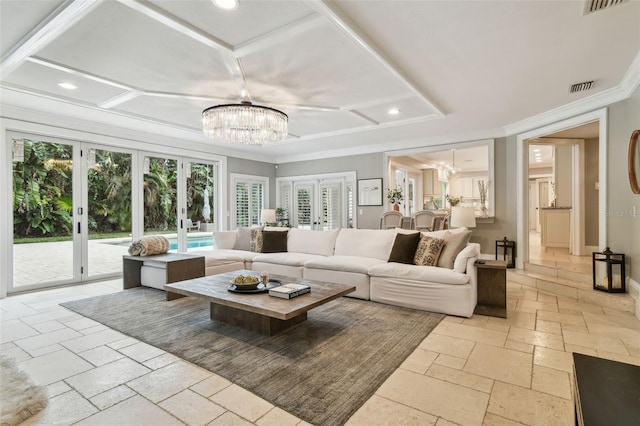 living room featuring a chandelier, a wealth of natural light, ornamental molding, and french doors