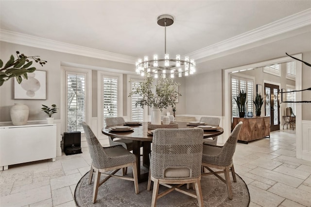 dining area featuring a chandelier and ornamental molding