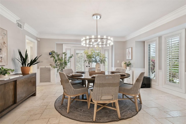 dining space featuring a notable chandelier, a wealth of natural light, and crown molding