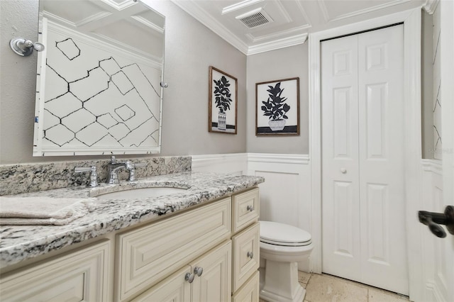 bathroom featuring vanity, toilet, and ornamental molding