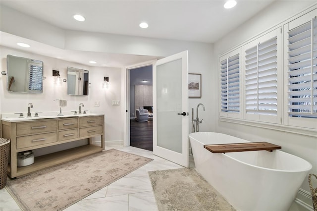 bathroom featuring a bathing tub and vanity