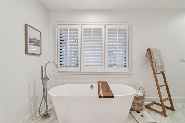 bathroom with a bathing tub and tile patterned floors