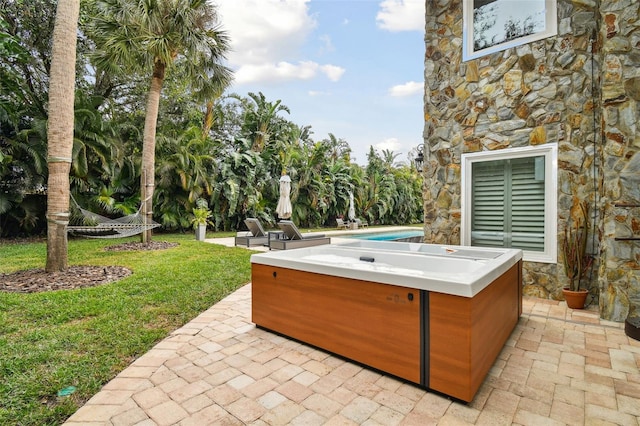 view of patio / terrace featuring a hot tub