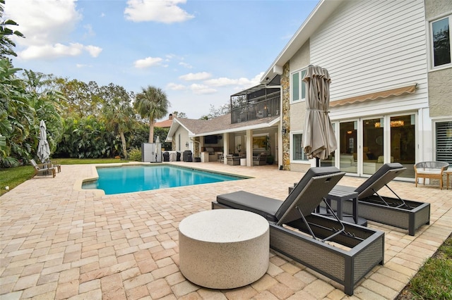 view of swimming pool featuring a patio area