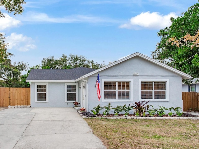 ranch-style home with a front yard