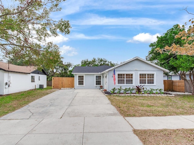 ranch-style home featuring a front yard